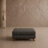 Monaco ottoman in dark grey fabric with wooden legs